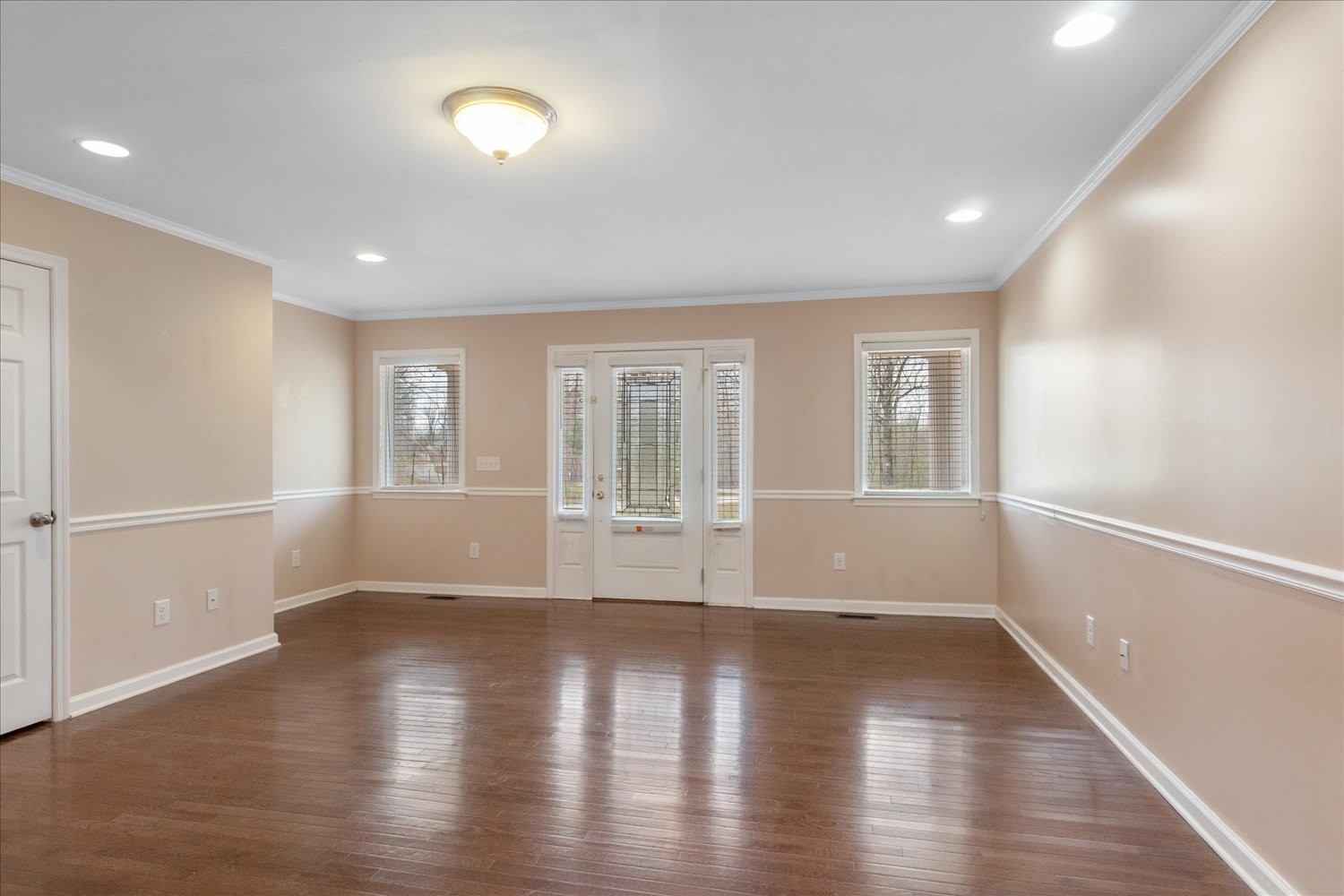 732 Tiger Bennett Road Hampshire, TN 38461 - Photo 13 of 35 an empty room with wooden floor and windows