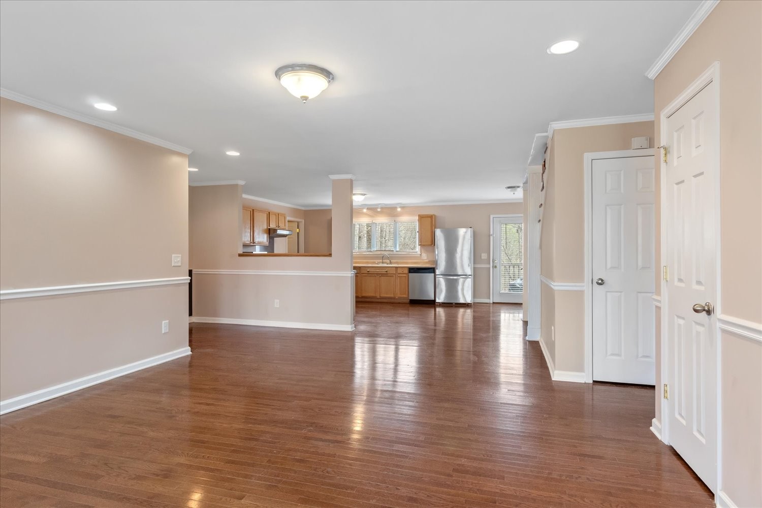 732 Tiger Bennett Road Hampshire, TN 38461 - Photo 15 of 35 a view of a kitchen with a fridge and wooden floor