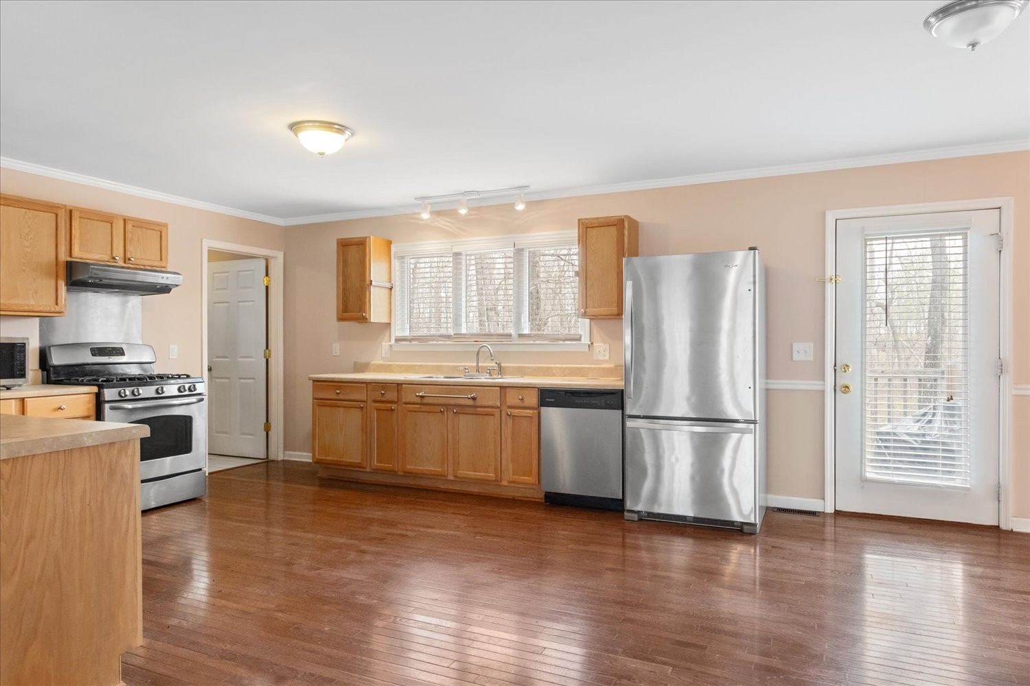 732 Tiger Bennett Road Hampshire, TN 38461 - Photo 16 of 35 a kitchen with stainless steel appliances a refrigerator and wooden cabinets
