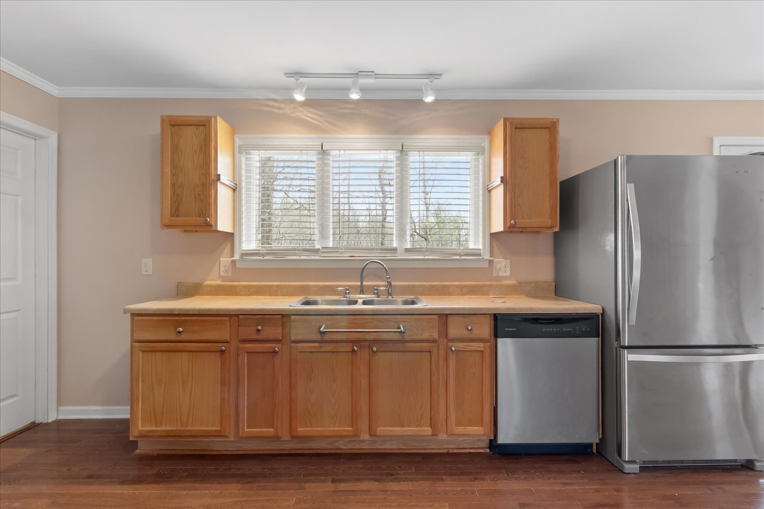 732 Tiger Bennett Road Hampshire, TN 38461 - Photo 19 of 35 a kitchen with stainless steel appliances granite countertop a sink and a refrigerator