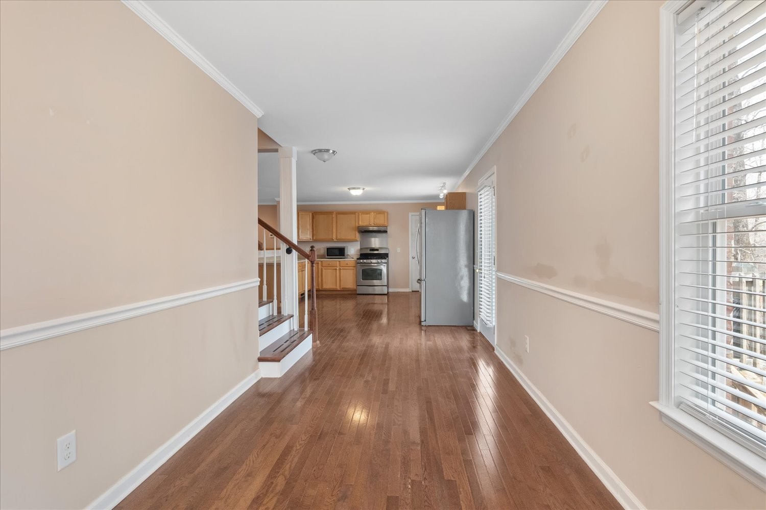 732 Tiger Bennett Road Hampshire, TN 38461 - Photo 22 of 35 a view of a hallway with wooden floor and staircase