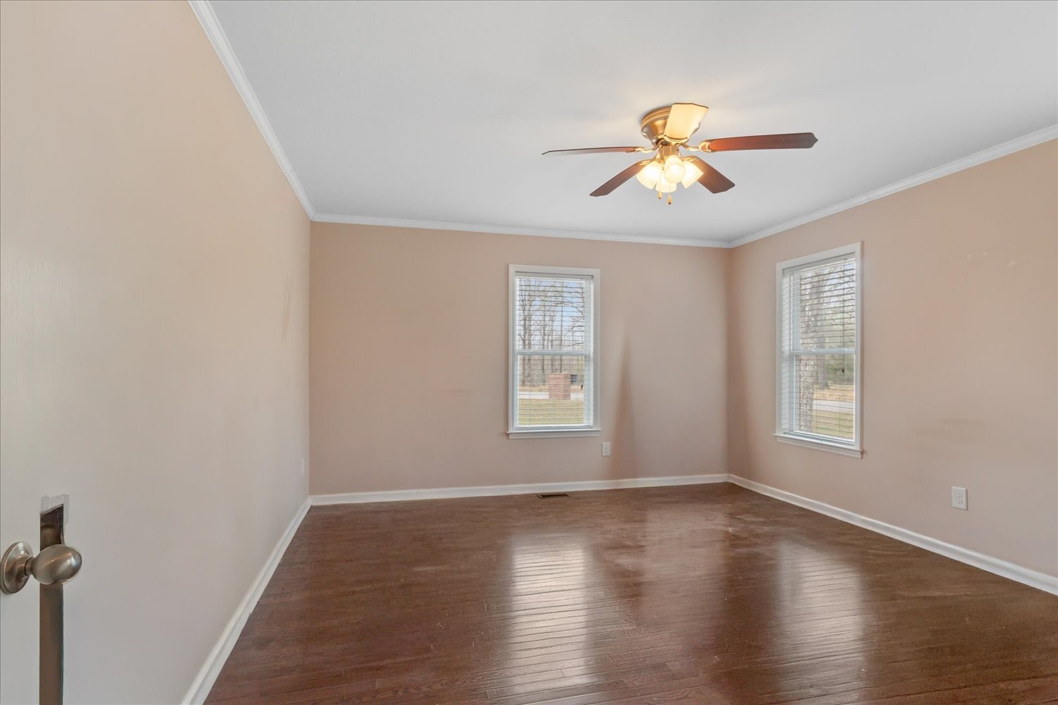 732 Tiger Bennett Road Hampshire, TN 38461 - Photo 23 of 35 a view of an empty room with wooden floor and a window