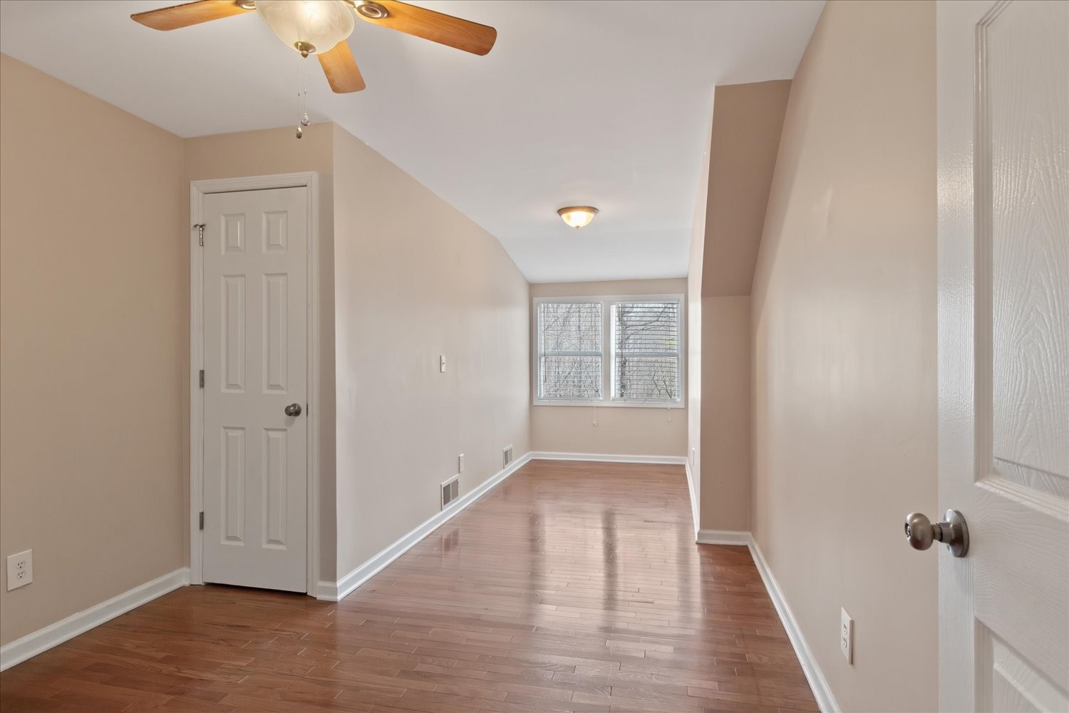 732 Tiger Bennett Road Hampshire, TN 38461 - Photo 29 of 35 an empty room with wooden floor cabinet and windows