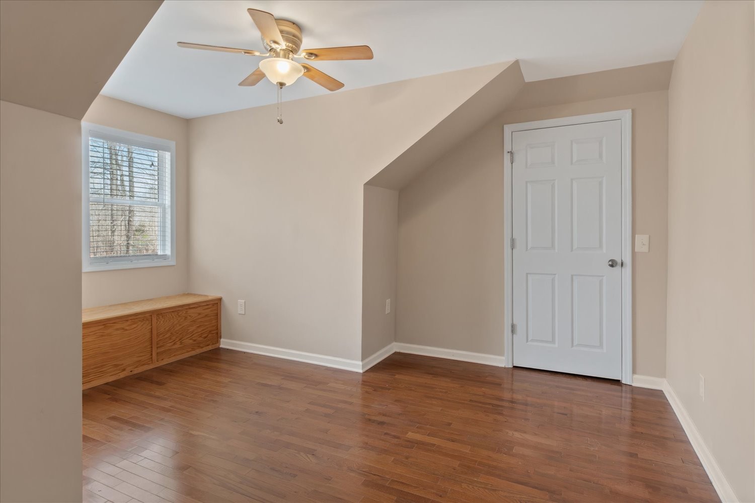 732 Tiger Bennett Road Hampshire, TN 38461 - Photo 30 of 35 an empty room with wooden floor ceiling fan and windows