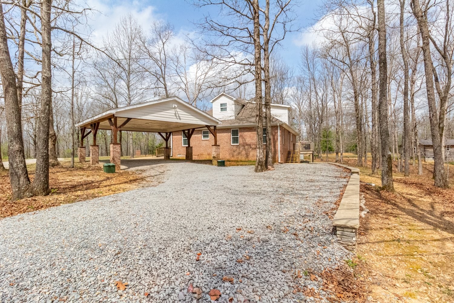 732 Tiger Bennett Road Hampshire, TN 38461 - Photo 6 of 35 a house with trees in front of it
