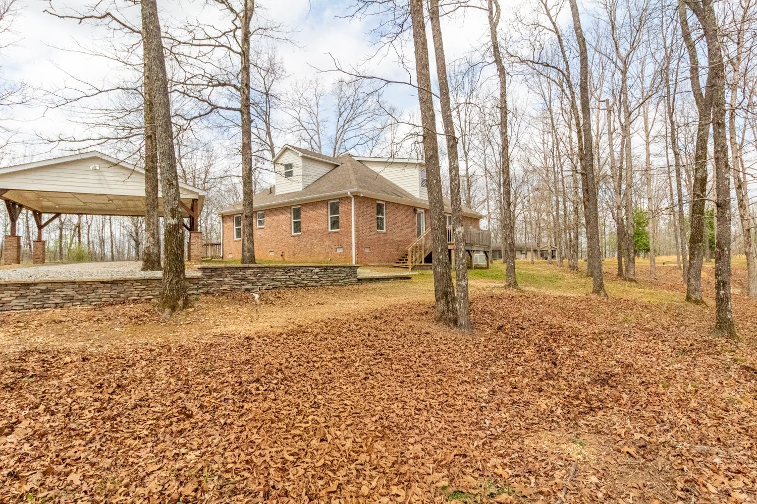 732 Tiger Bennett Road Hampshire, TN 38461 - Photo 7 of 35 a house with trees in front of it