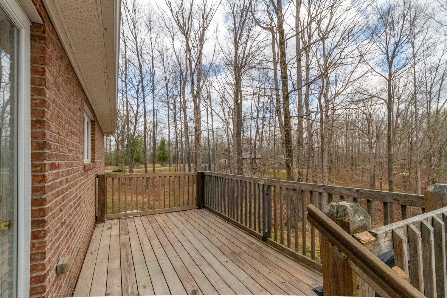 732 Tiger Bennett Road Hampshire, TN 38461 - Photo 10 of 35 a view of balcony with wooden floor and fence