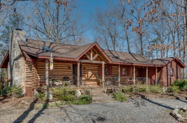322 Pleasant Hill Road Landrum, SC 29356 - Photo 1 of 23 a front view of a house with garden