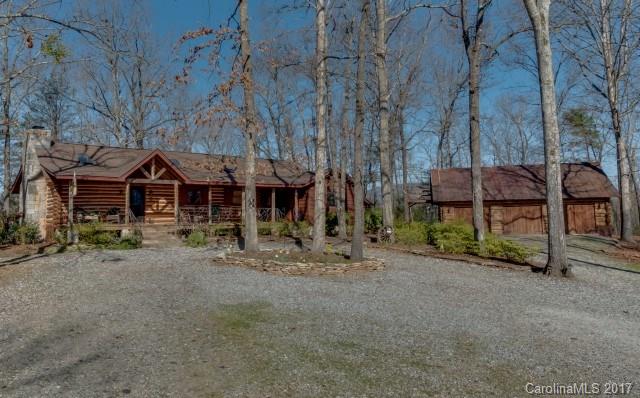 322 Pleasant Hill Road Landrum, SC 29356 - Photo 2 of 23 a view of a house with backyard and sitting area
