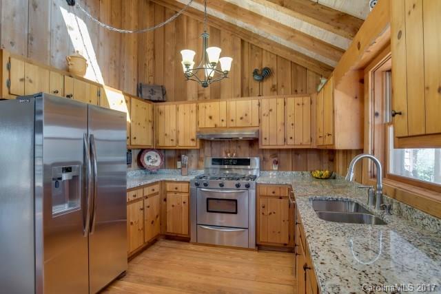 322 Pleasant Hill Road Landrum, SC 29356 - Photo 11 of 23 a kitchen with stainless steel appliances granite countertop a sink a stove and refrigerator