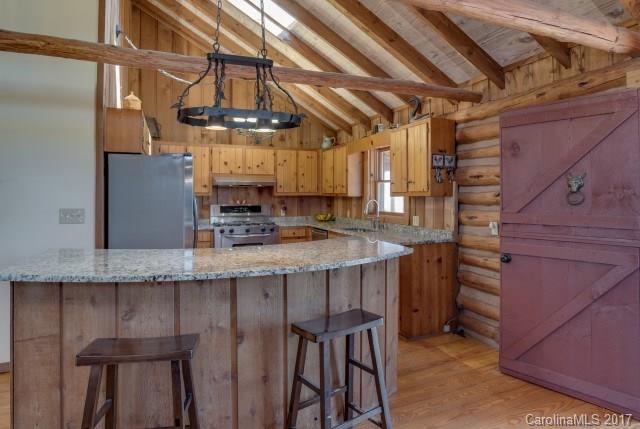 322 Pleasant Hill Road Landrum, SC 29356 - Photo 10 of 23 a kitchen with a table and chairs in it
