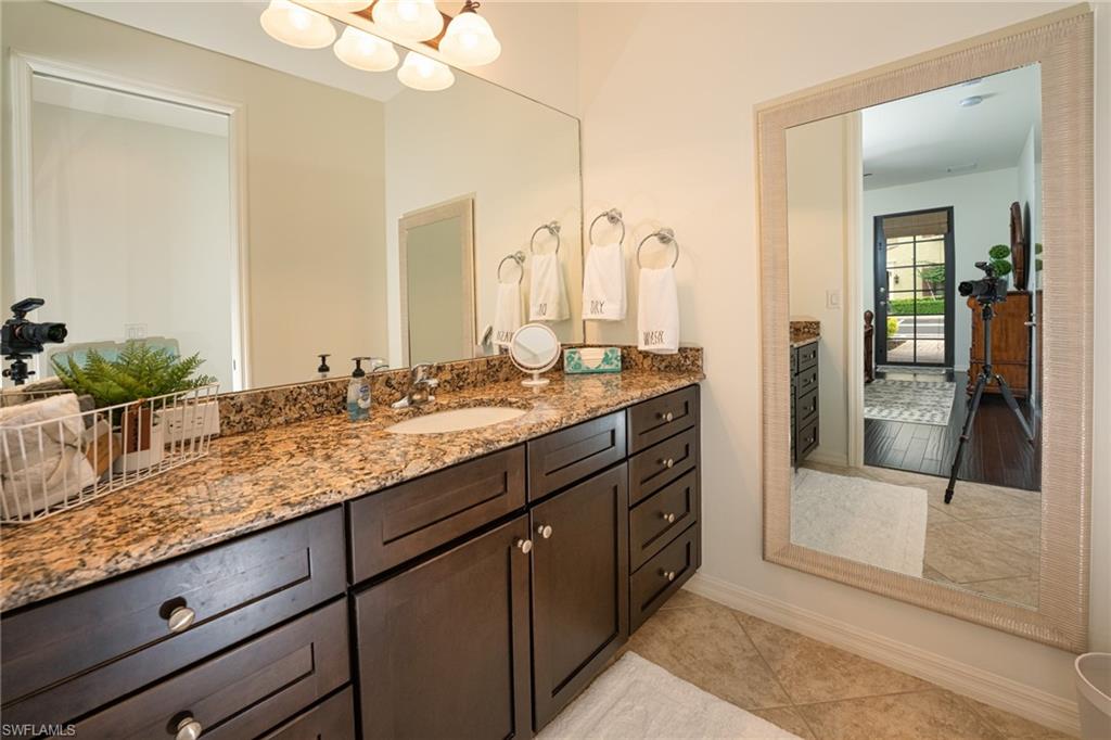 8986 Cambria Circle, Unit 22 Naples, FL 34113 - Photo 11 of 20 Bathroom featuring tile patterned flooring and vanity