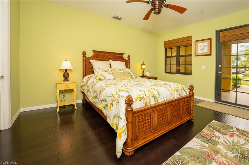 8986 Cambria Circle, Unit 22 Naples, FL 34113 - Photo 13 of 20 Bedroom featuring dark hardwood / wood-style flooring and ceiling fan