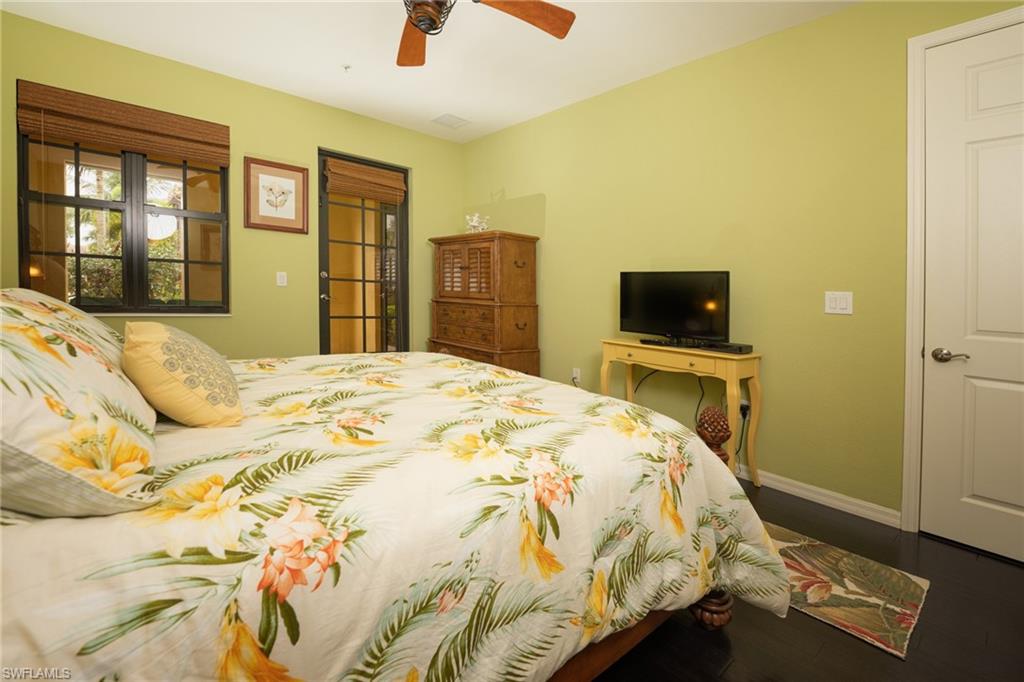 8986 Cambria Circle, Unit 22 Naples, FL 34113 - Photo 15 of 20 Bedroom featuring hardwood / wood-style floors and ceiling fan
