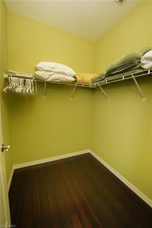 8986 Cambria Circle, Unit 22 Naples, FL 34113 - Photo 16 of 20 Spacious closet with wood-type flooring