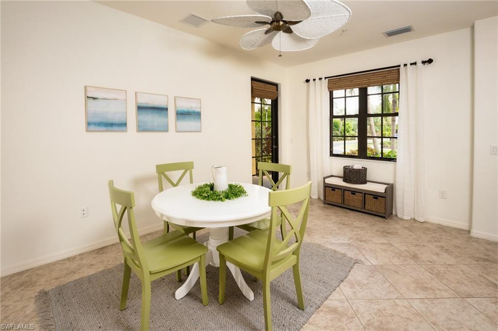 8986 Cambria Circle, Unit 22 Naples, FL 34113 - Photo 5 of 20 Tiled dining space with ceiling fan