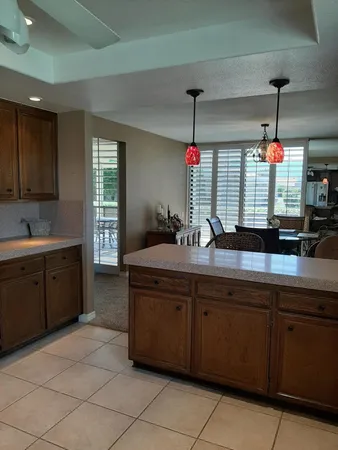 a kitchen with sink and window