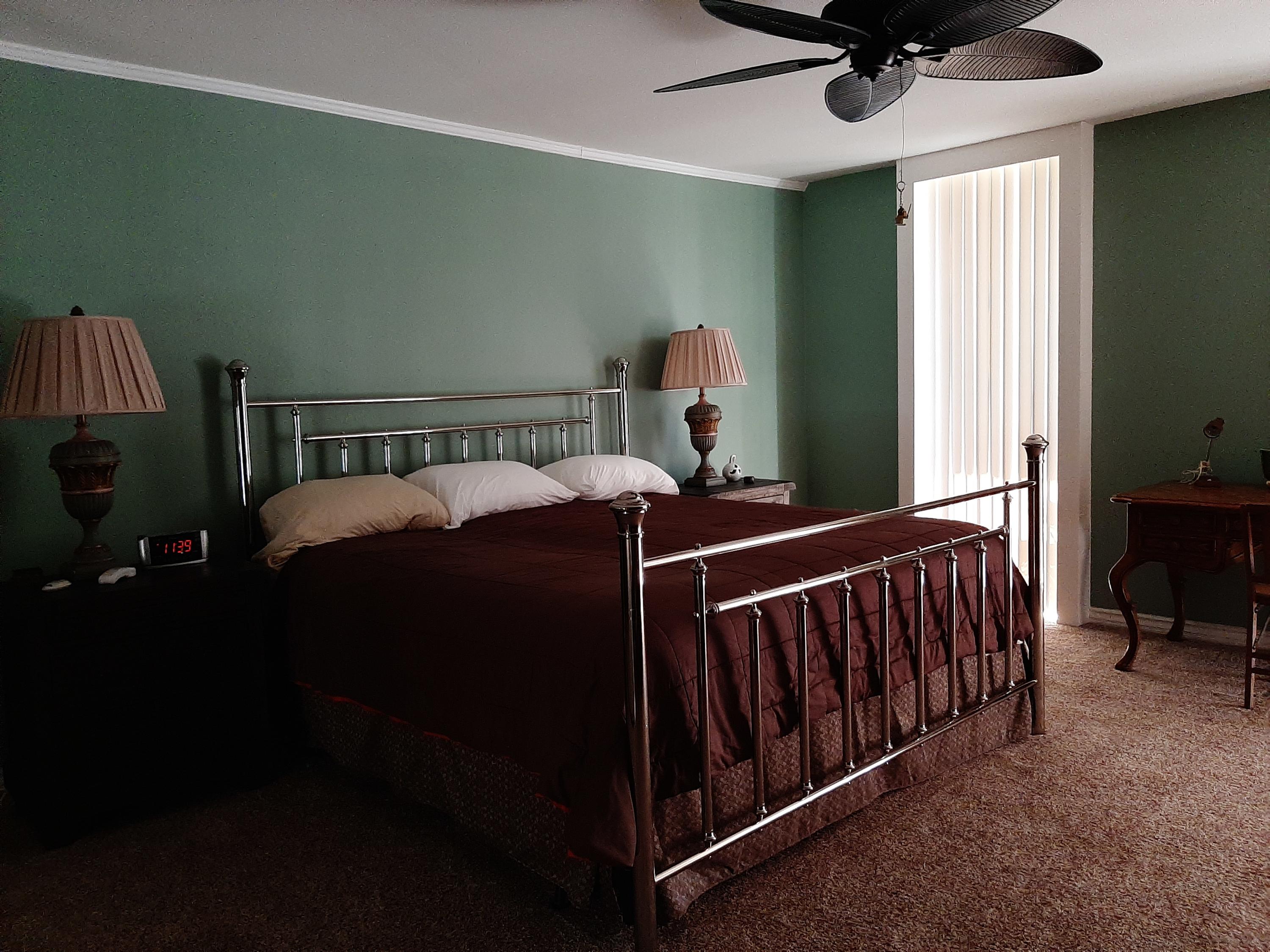 72385 Beverly Way Rancho Mirage, CA 92270 - Photo 20 of 24 a bed sitting in a bedroom next to a window