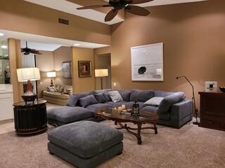 72385 Beverly Way Rancho Mirage, CA 92270 - Photo 2 of 24 a living room with furniture and a mirror