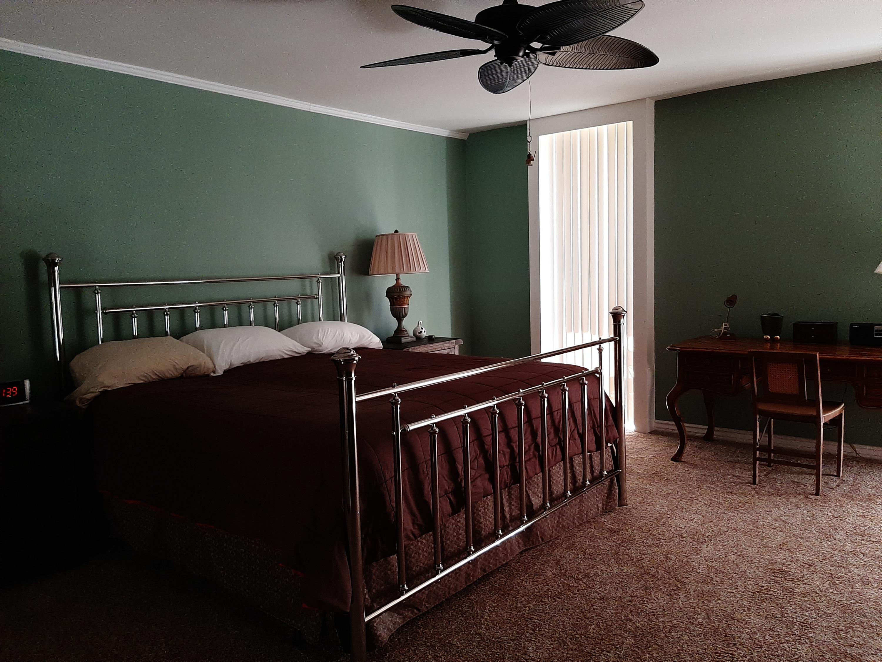 72385 Beverly Way Rancho Mirage, CA 92270 - Photo 21 of 24 a bedroom with furniture and a window