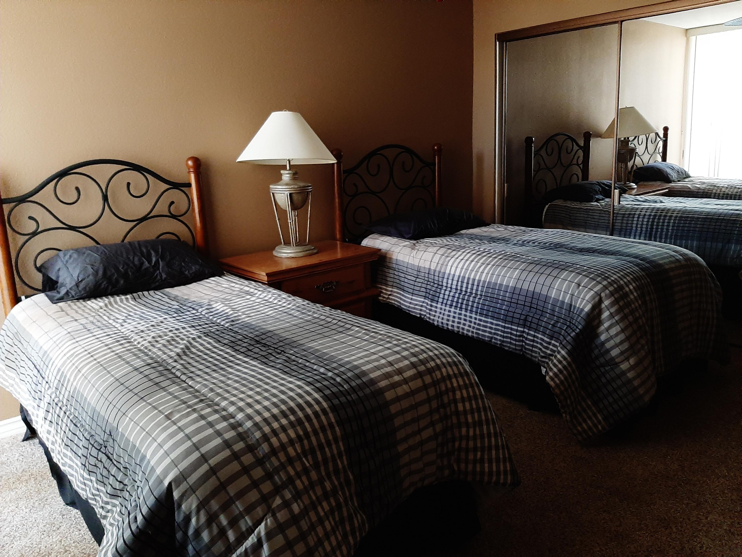 72385 Beverly Way Rancho Mirage, CA 92270 - Photo 24 of 24 a bedroom with double bed and a chandelier