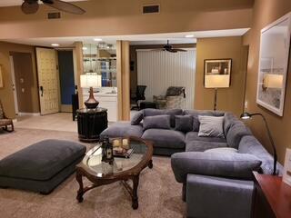 72385 Beverly Way Rancho Mirage, CA 92270 - Photo 3 of 24 a living room with furniture and a large mirror