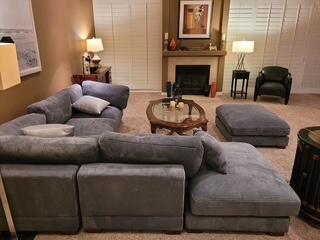 72385 Beverly Way Rancho Mirage, CA 92270 - Photo 5 of 24 a living room with furniture a fireplace and a lamp