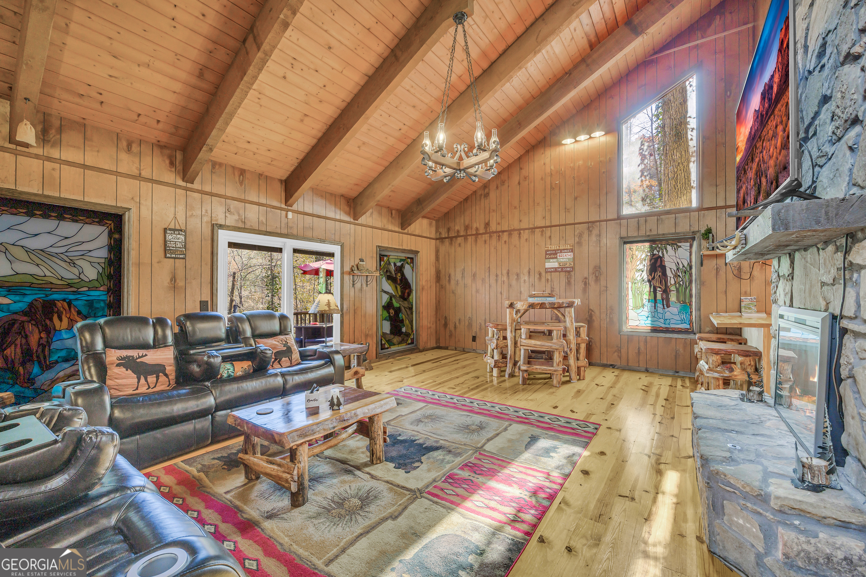 243 Ridge Road Helen, GA 30545 - Photo 11 of 82 a living room with furniture and a dining table with rug