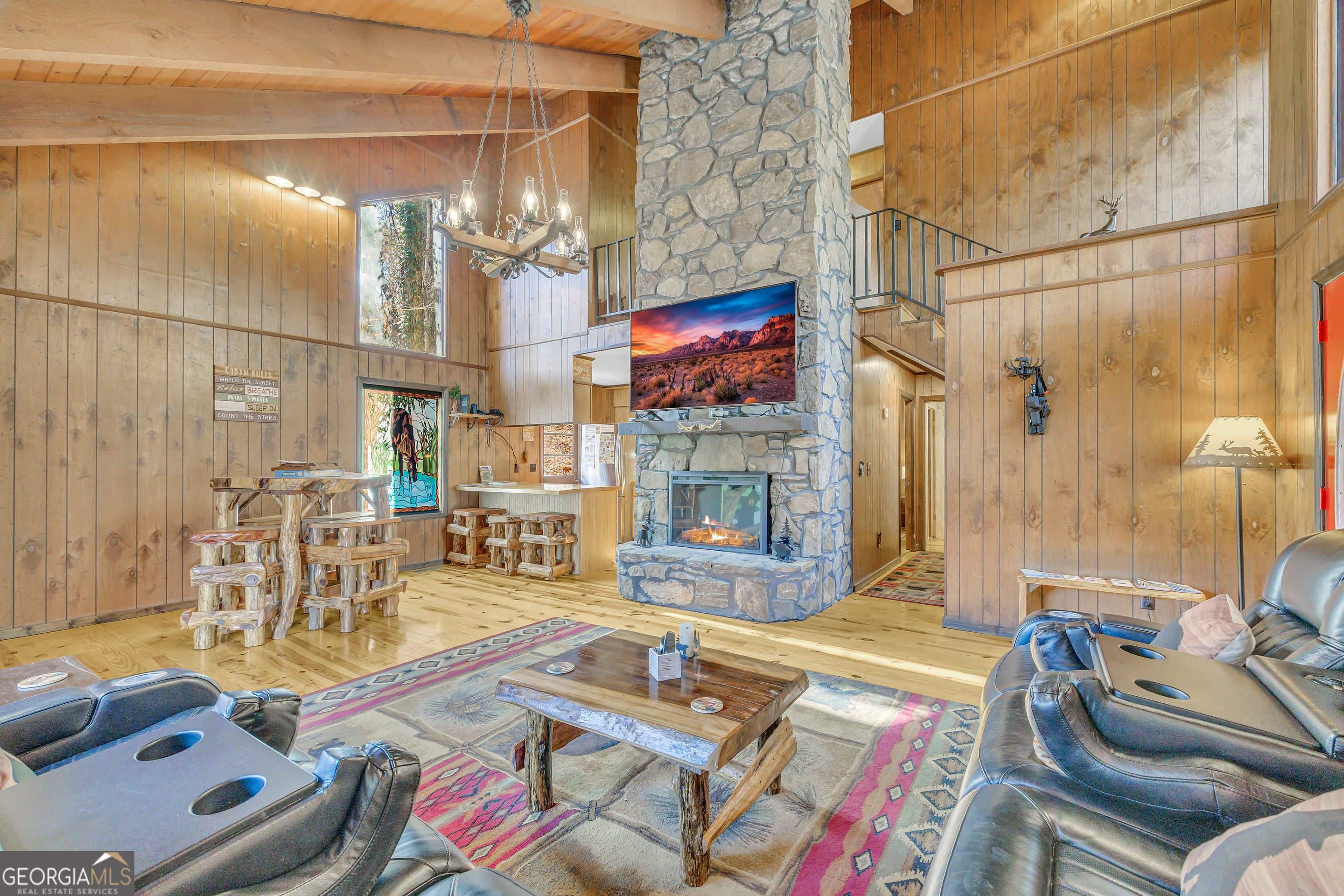 243 Ridge Road Helen, GA 30545 - Photo 14 of 82 a living room with furniture and a fireplace