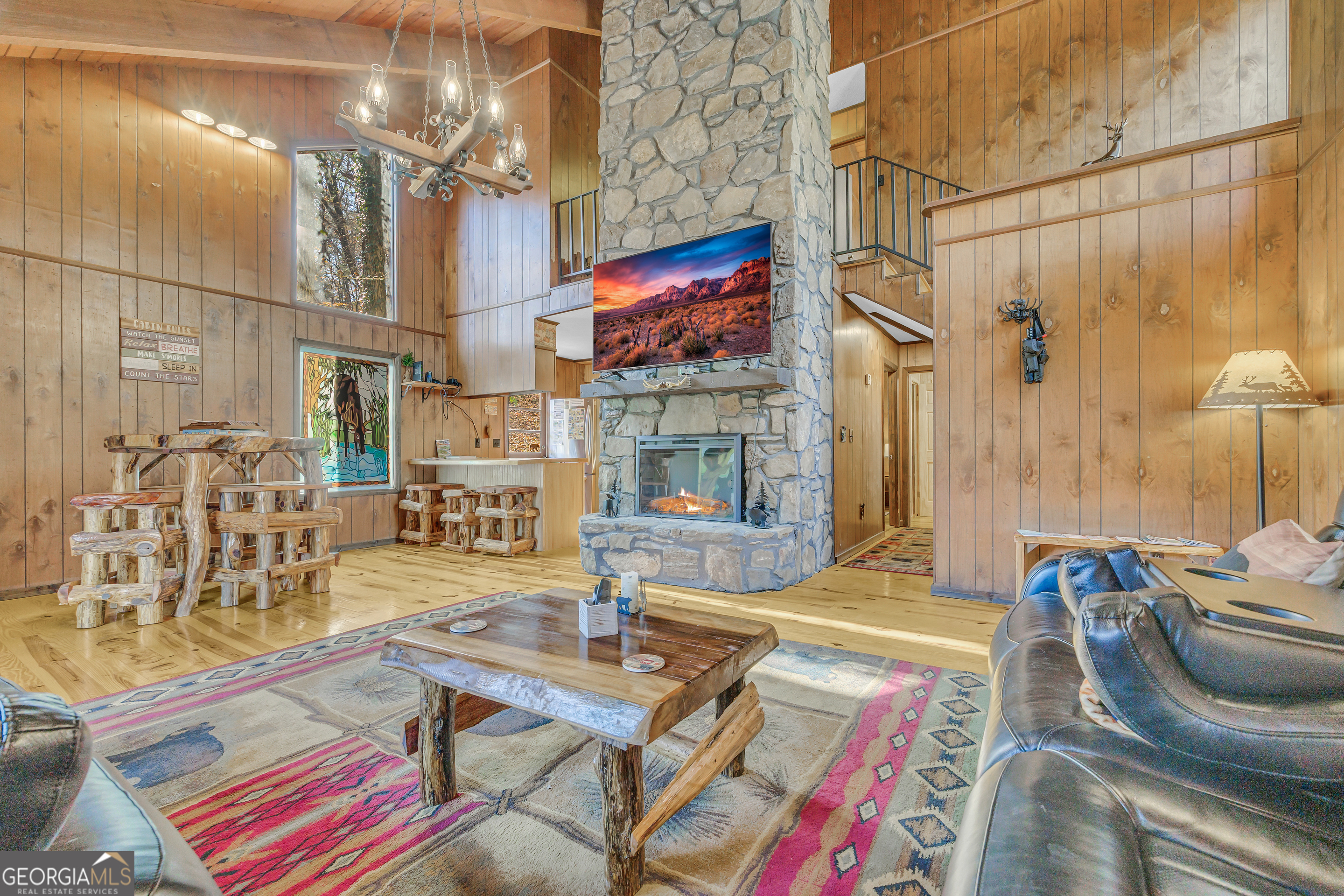 243 Ridge Road Helen, GA 30545 - Photo 16 of 82 a living room with patio furniture and a fireplace