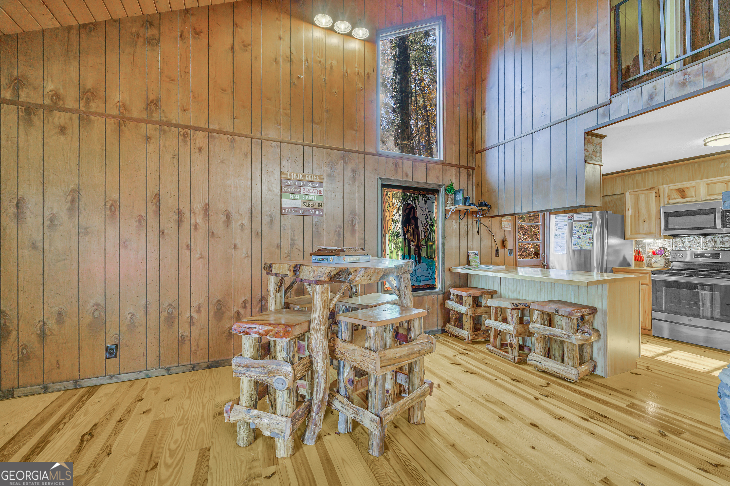 243 Ridge Road Helen, GA 30545 - Photo 20 of 82 a view of a kitchen with furniture and wooden floor