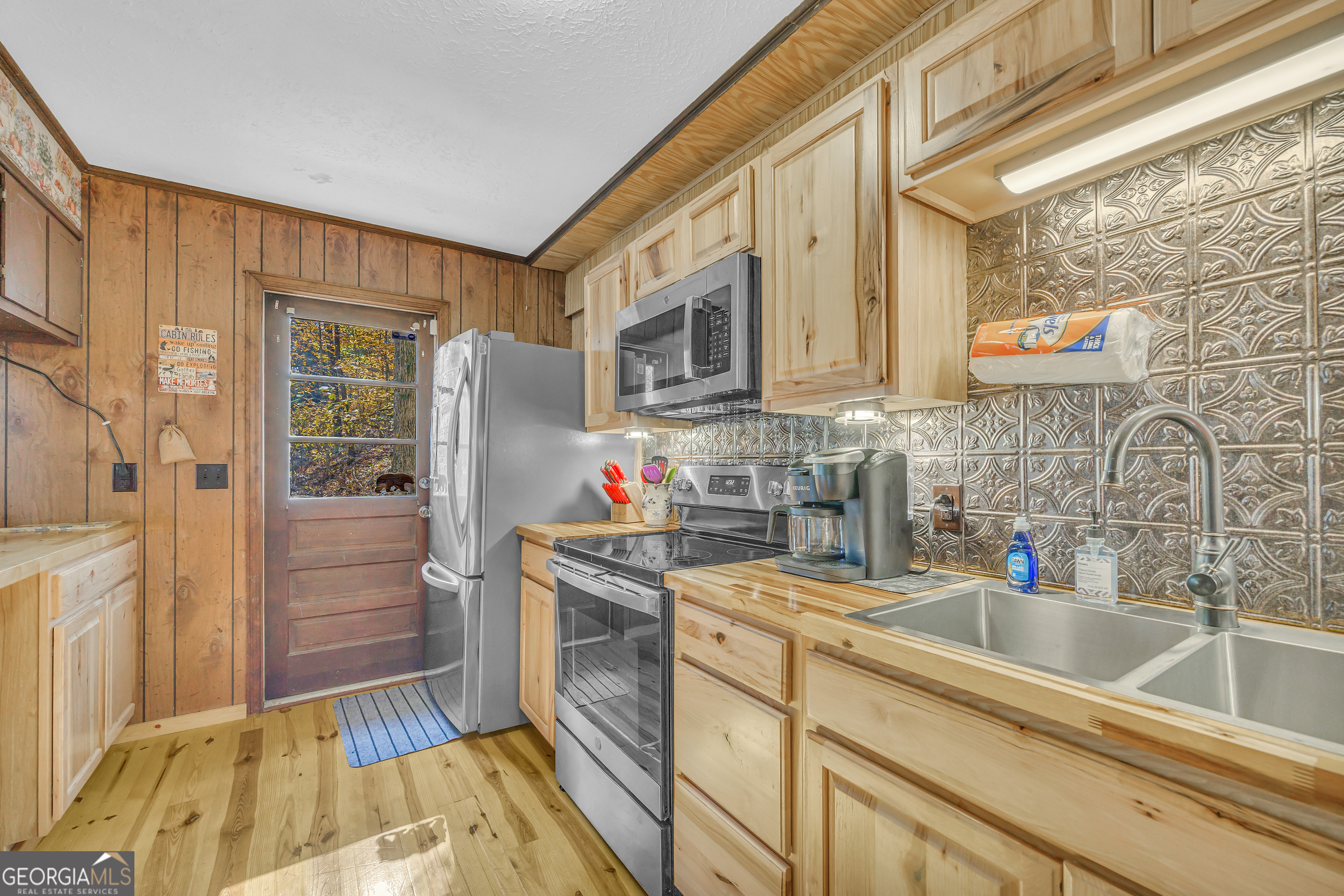 243 Ridge Road Helen, GA 30545 - Photo 26 of 82 a kitchen with stainless steel appliances granite countertop a sink and cabinets