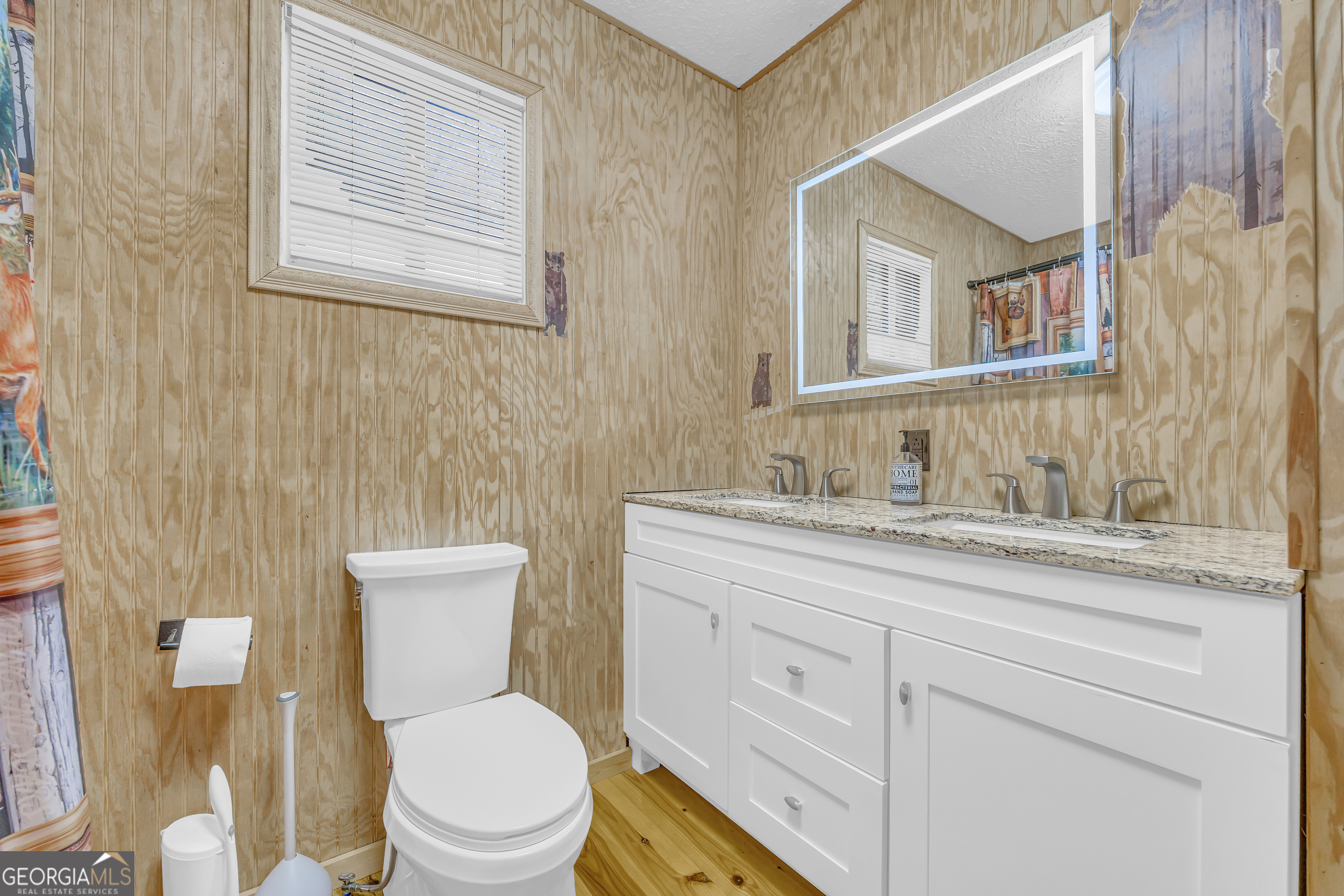 243 Ridge Road Helen, GA 30545 - Photo 33 of 82 a bathroom with a toilet a sink and mirror