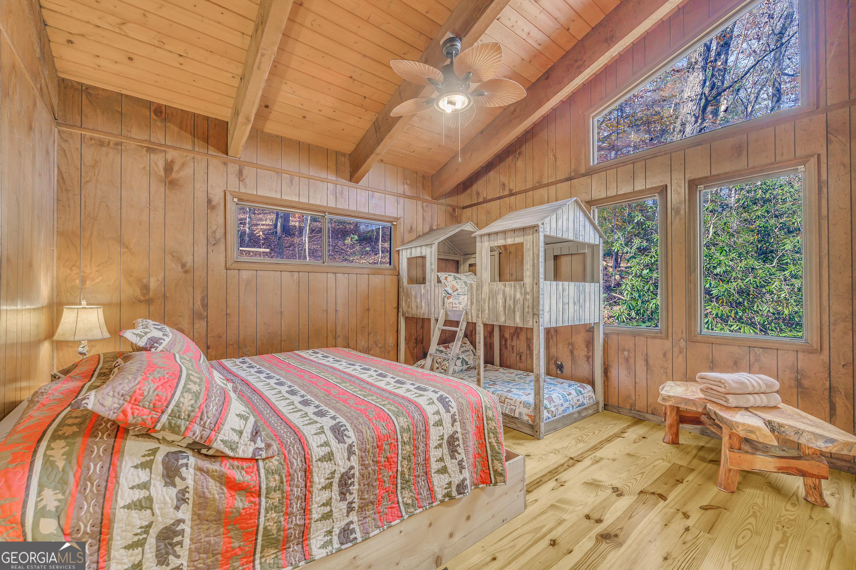 243 Ridge Road Helen, GA 30545 - Photo 39 of 82 a bedroom with a bed and wooden floor