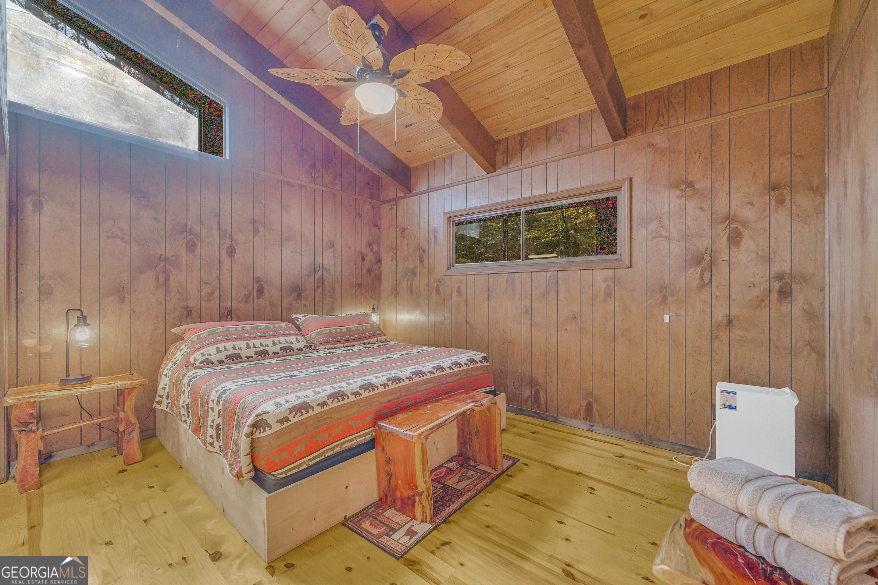 243 Ridge Road Helen, GA 30545 - Photo 41 of 82 a bedroom with a bed and a couch