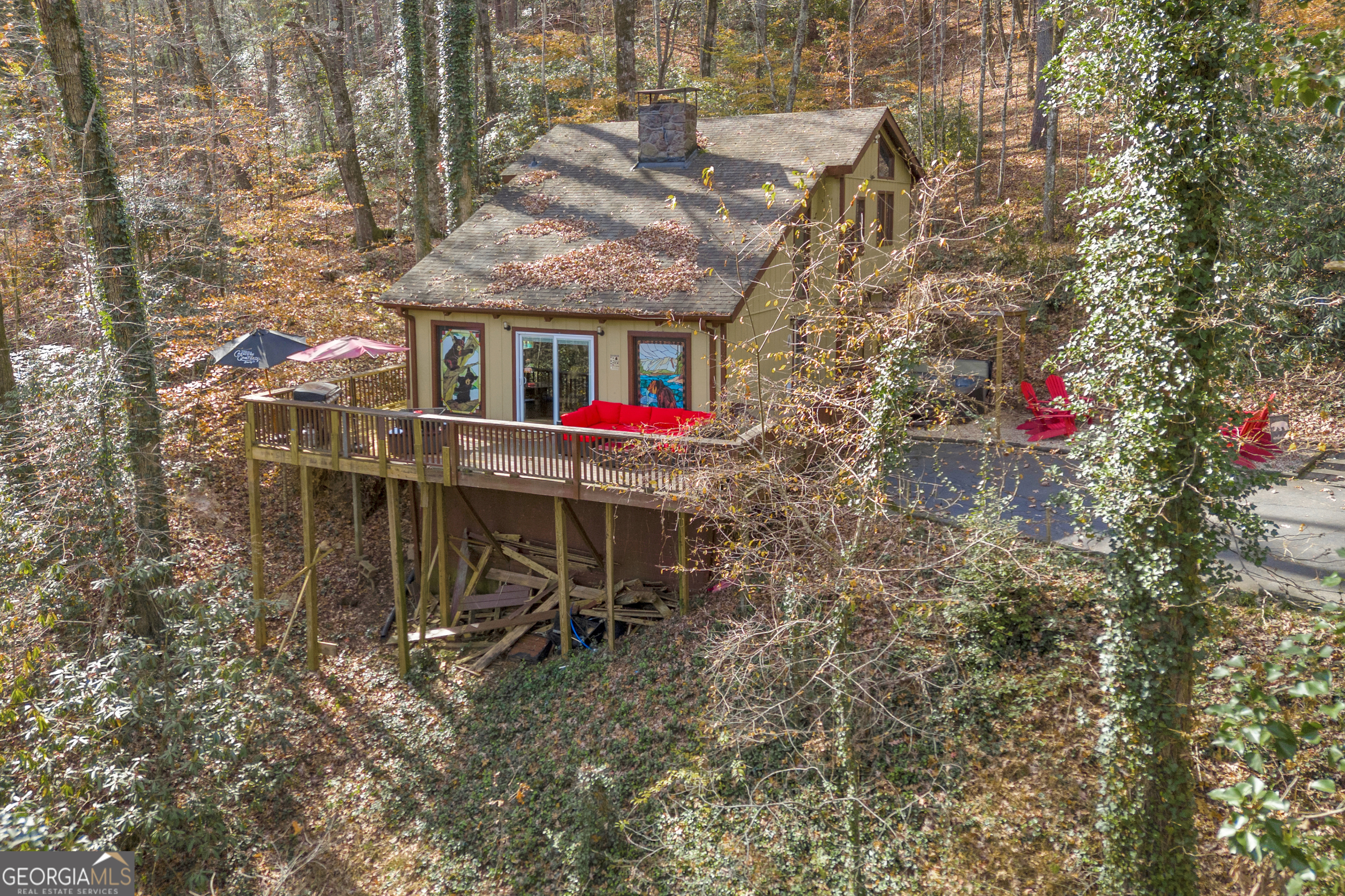 243 Ridge Road Helen, GA 30545 - Photo 50 of 82 a view of a chairs and table in the backyard