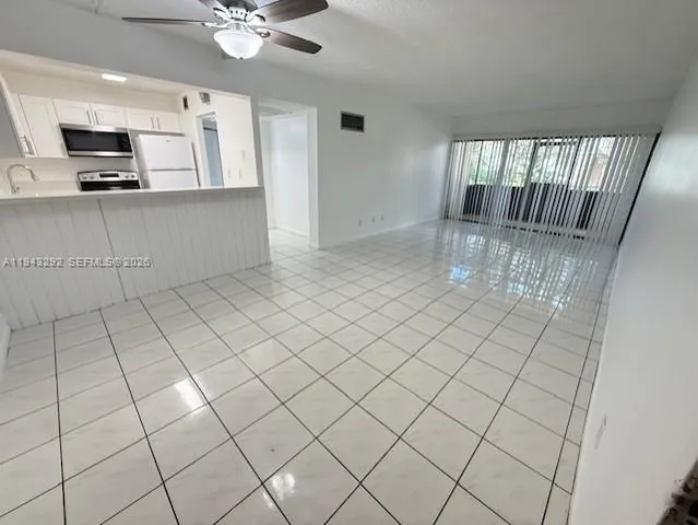 a view of an empty room and entryway