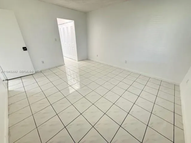 a view of a room and window