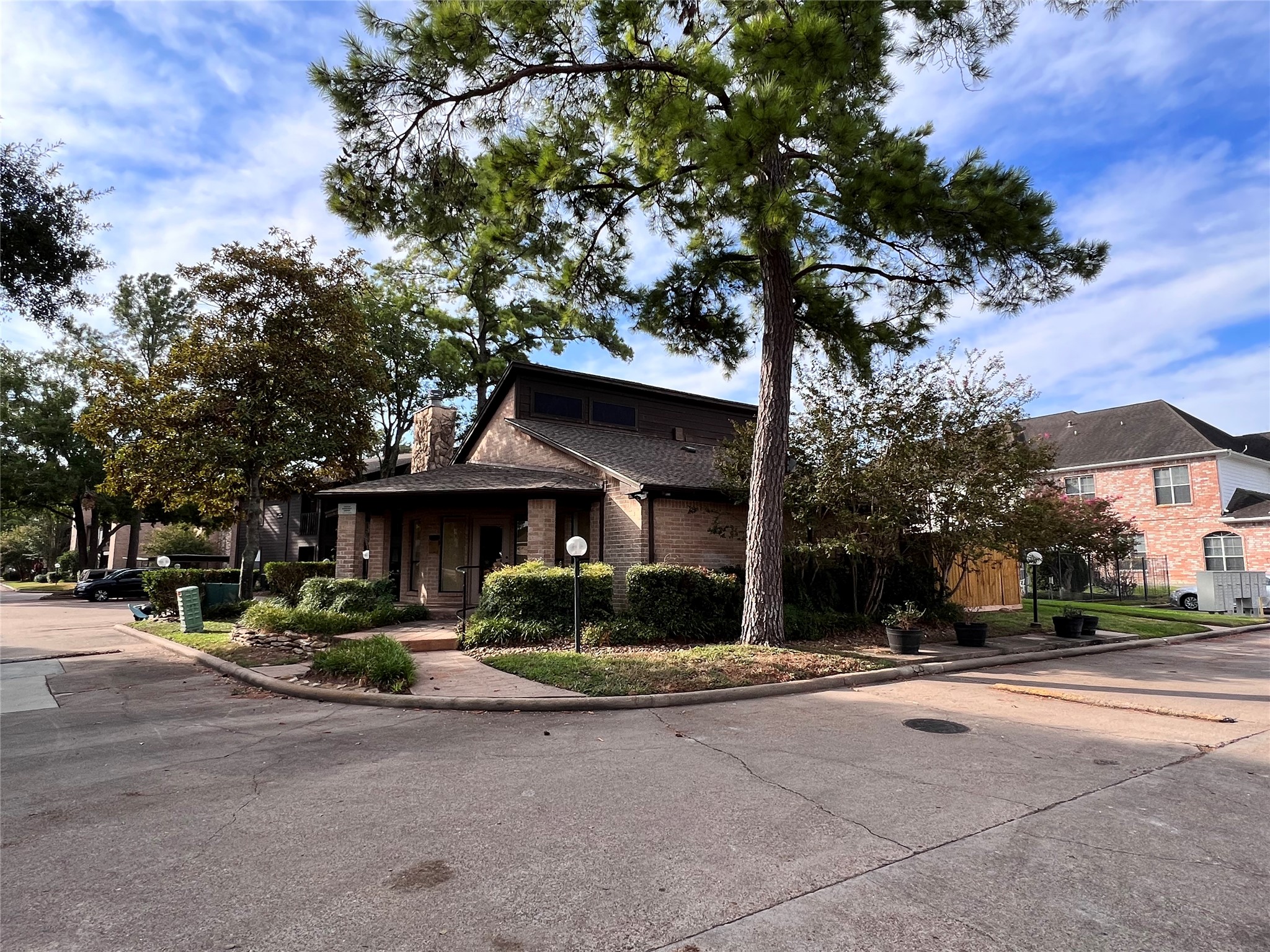 12755 Mill Ridge Drive, Unit 311 Cypress, TX 77429 - Photo 16 of 17 a front view of a house with basket ball court and outdoor seating