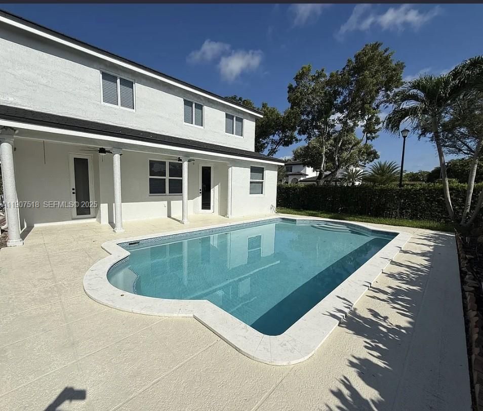 12427 Southwest 121st Avenue Miami, FL 33186 - Photo 23 of 33 a view of a house with swimming pool