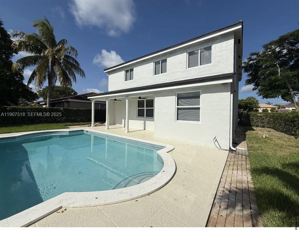12427 Southwest 121st Avenue Miami, FL 33186 - Photo 24 of 33 a view of a house with a swimming pool
