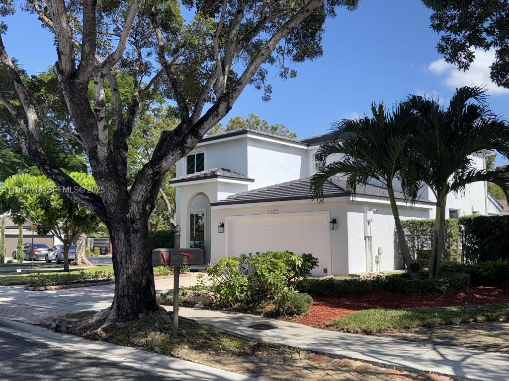 12427 Southwest 121st Avenue Miami, FL 33186 - Photo 30 of 33 a front view of a house with garden