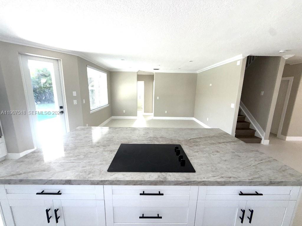 12427 Southwest 121st Avenue Miami, FL 33186 - Photo 10 of 33 a kitchen with a sink and a stove