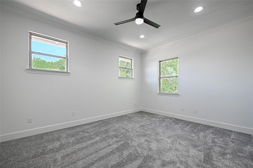 6301 Churchill Way Dallas, TX 75230 - Photo 32 of 40 Carpeted empty room featuring recessed lighting, crown molding, a ceiling fan, and baseboards