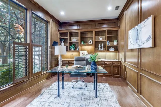 a bed room with a bed and a chair