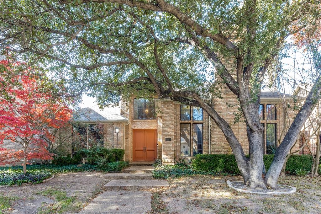 7155 Helsem Bend Circle Dallas, TX 75230 - Photo 2 of 26 a front view of a house with a yard and large trees