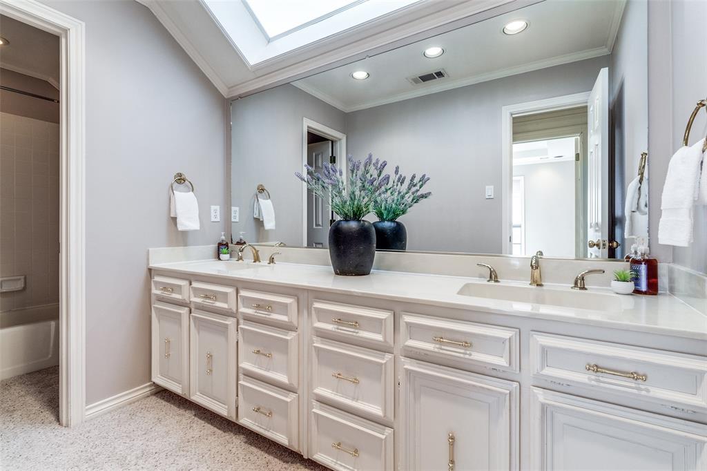 7155 Helsem Bend Circle Dallas, TX 75230 - Photo 21 of 26 a bathroom with a double vanity sink and a mirror