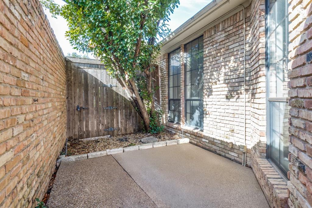 7155 Helsem Bend Circle Dallas, TX 75230 - Photo 23 of 26 a view of backyard with a barn and a large cactus tree