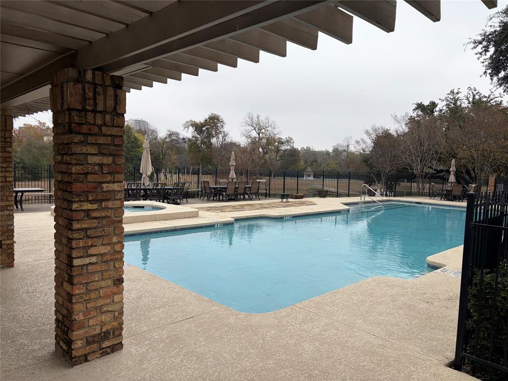 7155 Helsem Bend Circle Dallas, TX 75230 - Photo 26 of 26 a view of a swimming pool with lake and mountain view