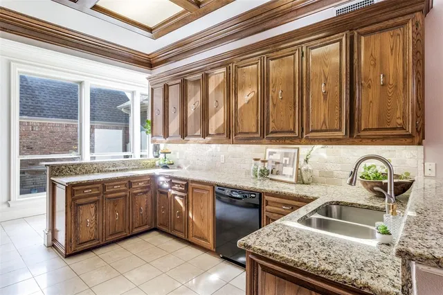 a kitchen with stainless steel appliances granite countertop a sink and cabinets